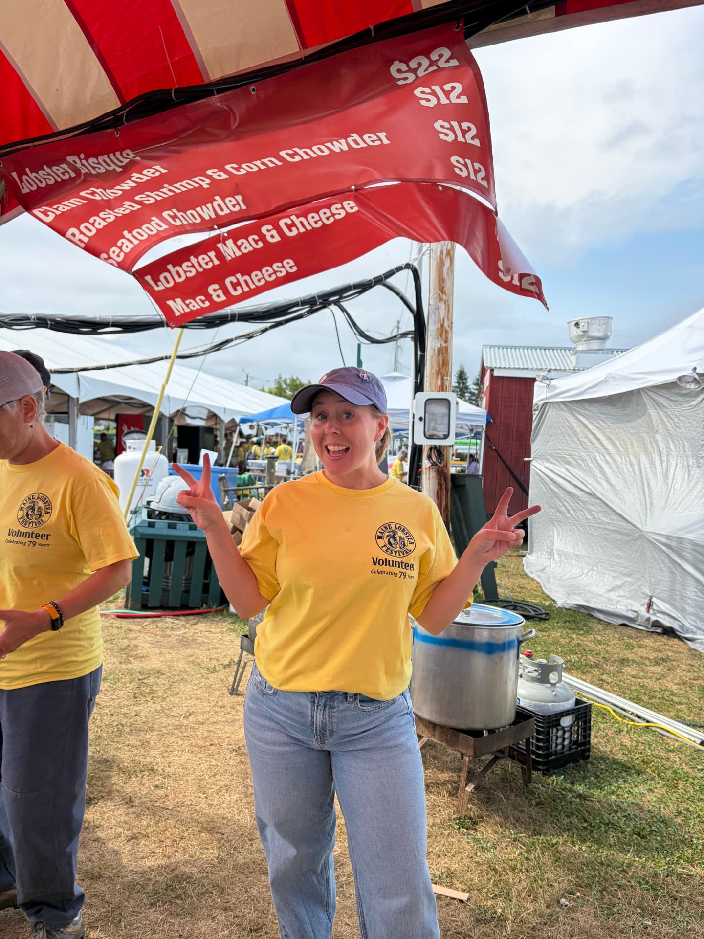 Granite Coast Orthodontics team member under the food tent at the Maine Lobster Festival