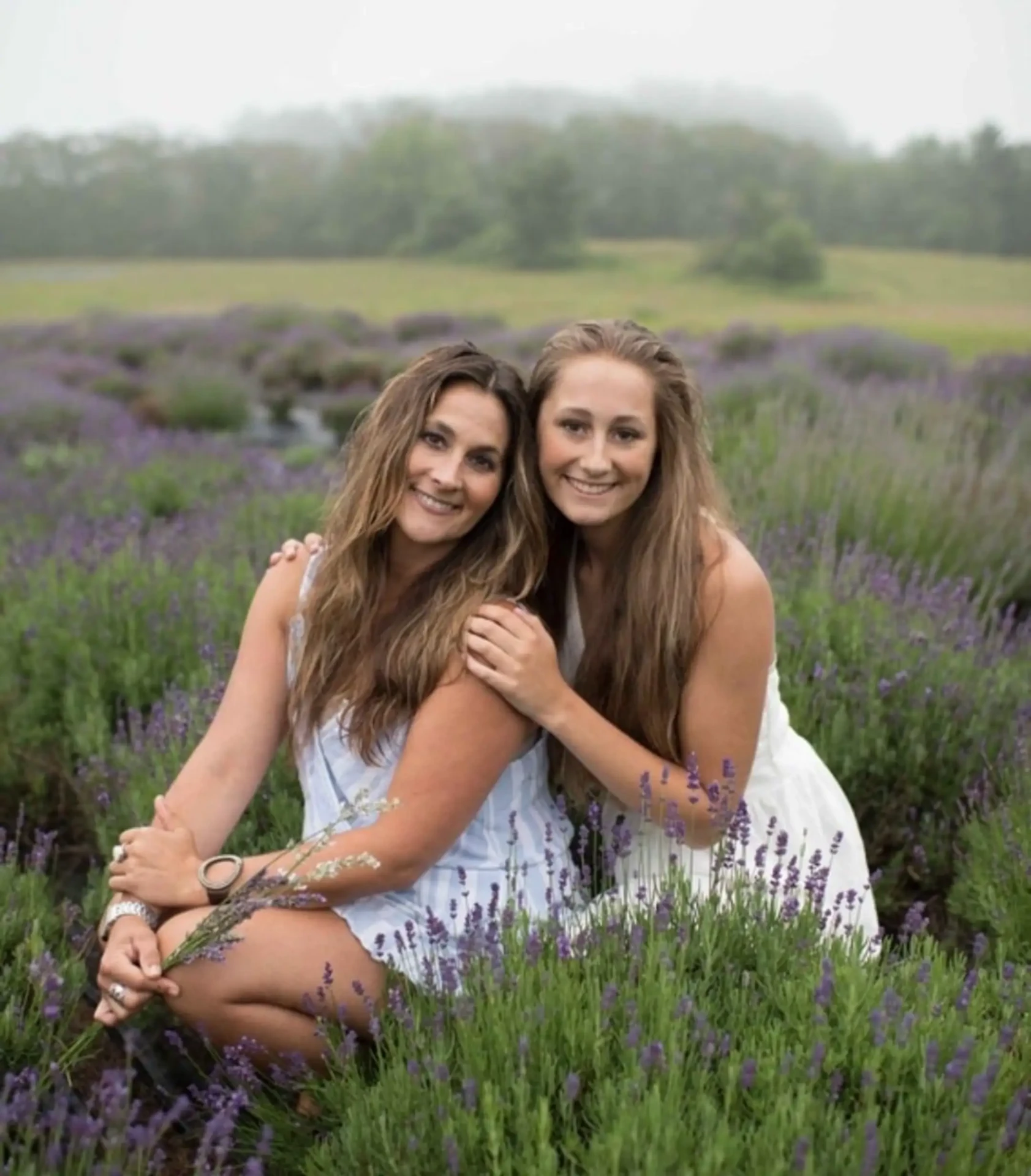Two smiling patients together in a lavender field