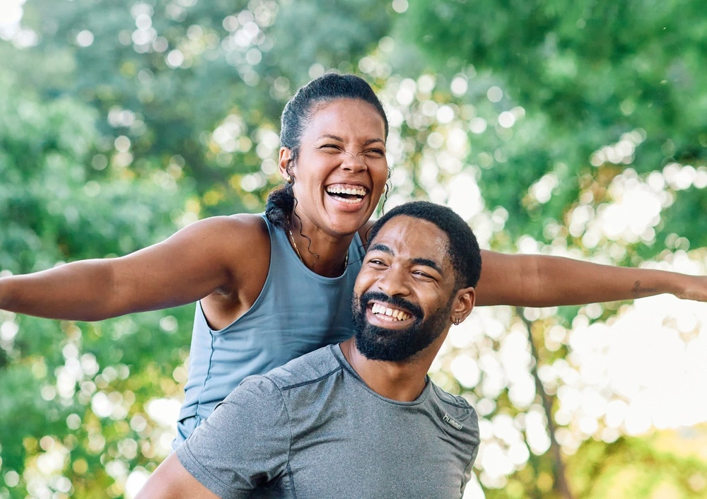 Two people smiling outdoors