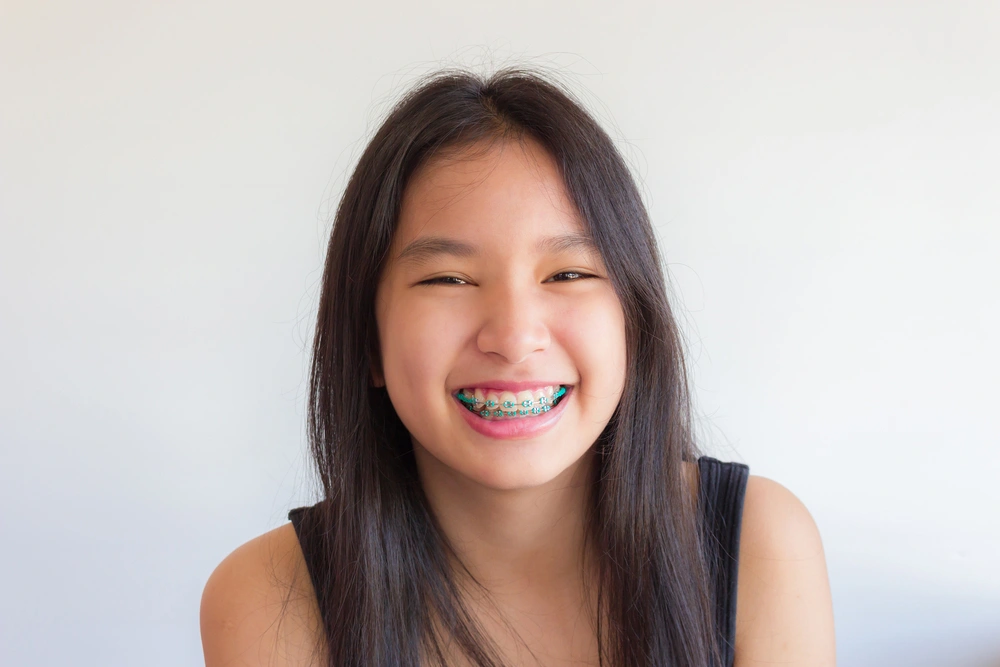 Teen smiling with braces