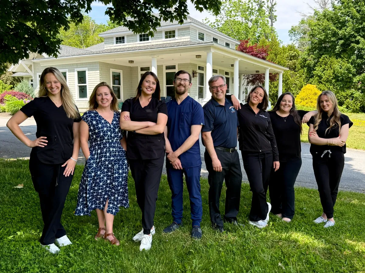 Granite Coast Orthodontics team standing outside the office
